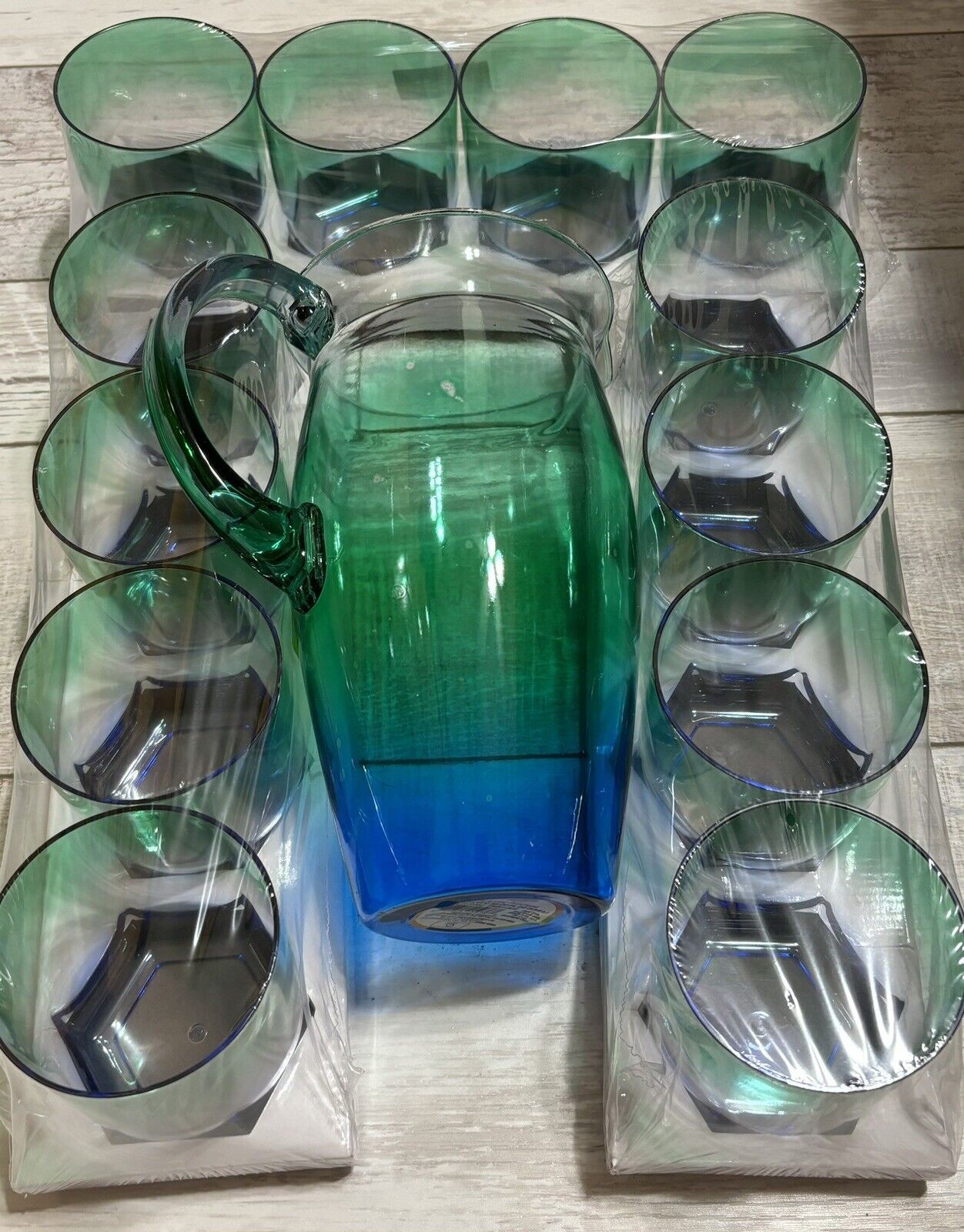 1265897149-1.jpg 4 Plastic 10 Oz Tumblers Clear W/Blue Green Hue - Image 1